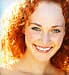Smiling woman, red hair 