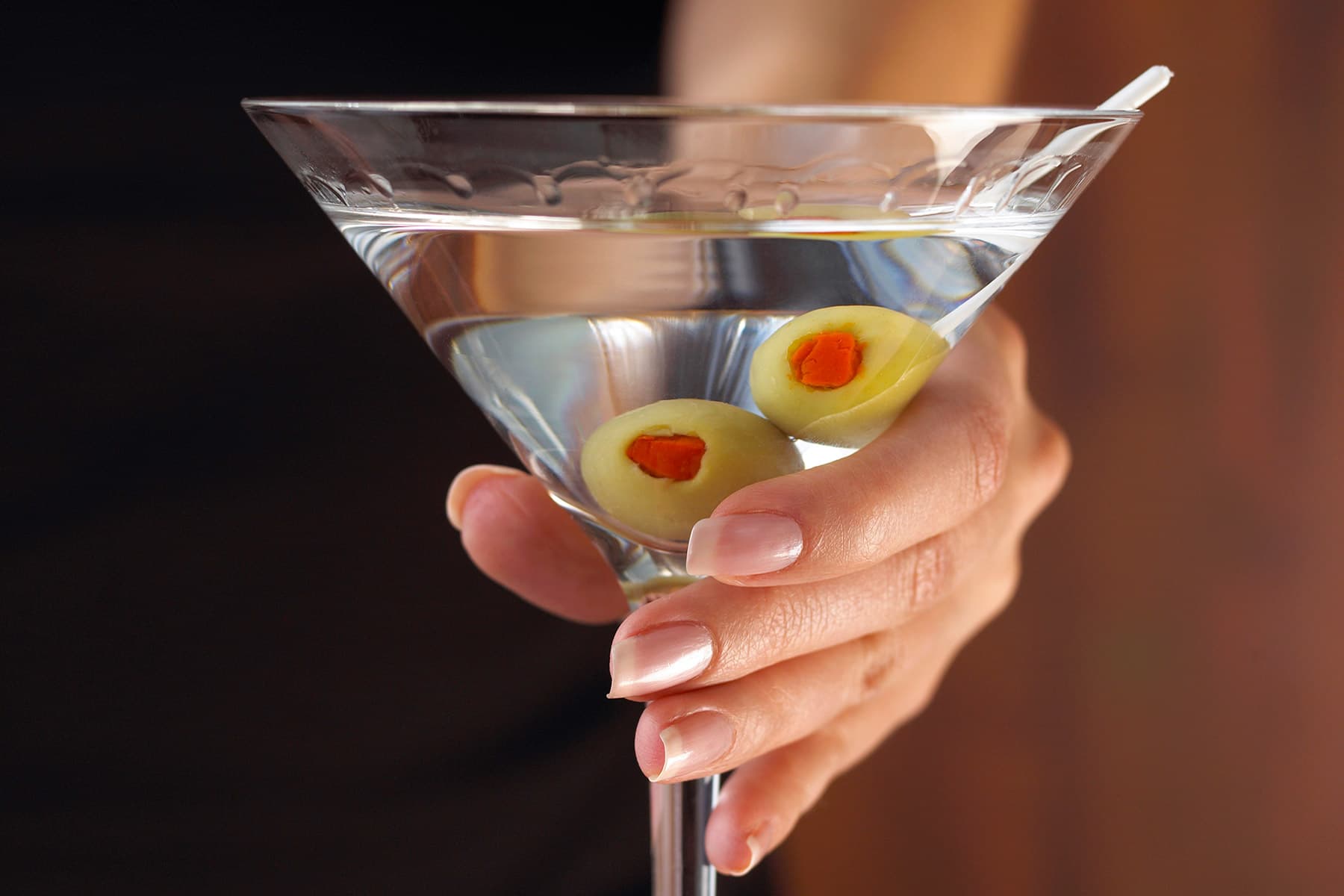 woman holding martini