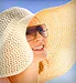 woman in bright sun with hat