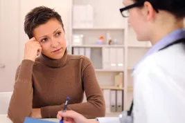 woman talking with doctor