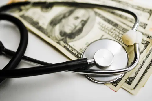 stethoscope and dollars