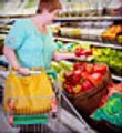 mature woman shopping for produce