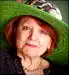 senior woman wearing green hat
