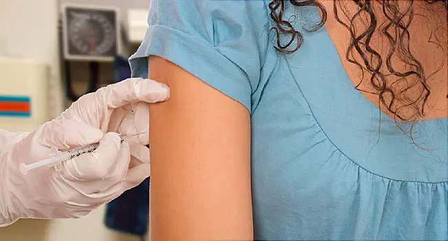 teen girl getting vaccinated