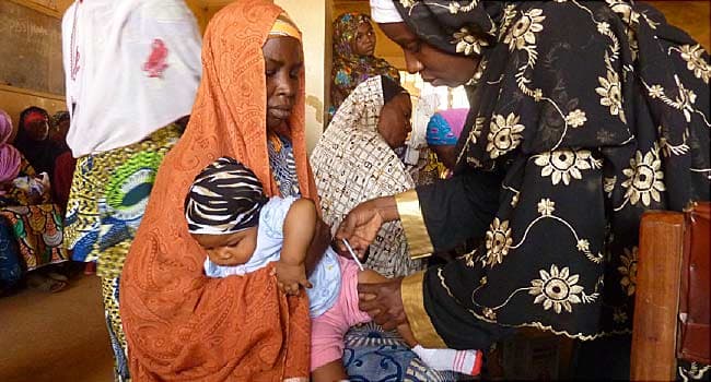 baby getting polio vaccine in nigeria