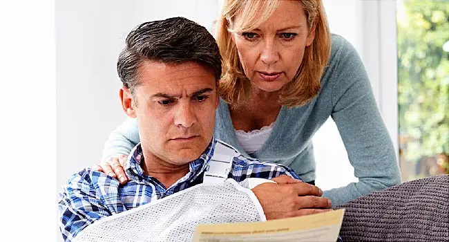 mature couple looking at insurance documents