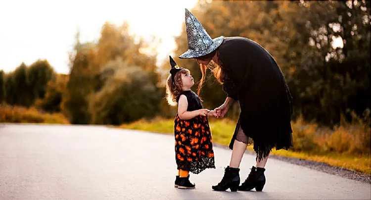 mom and daughter in Halloween costumes