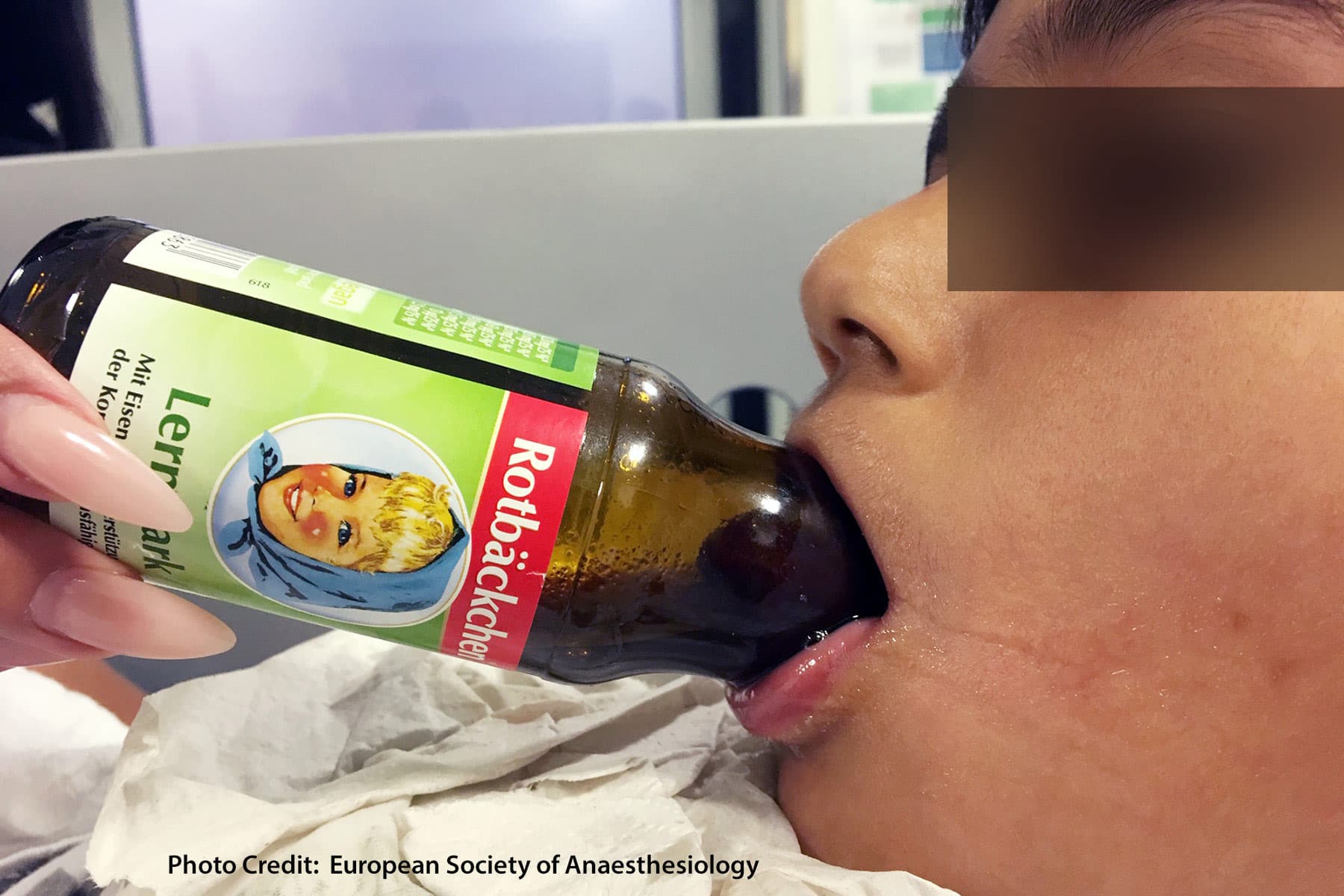 boy with tongue stuck in bottle