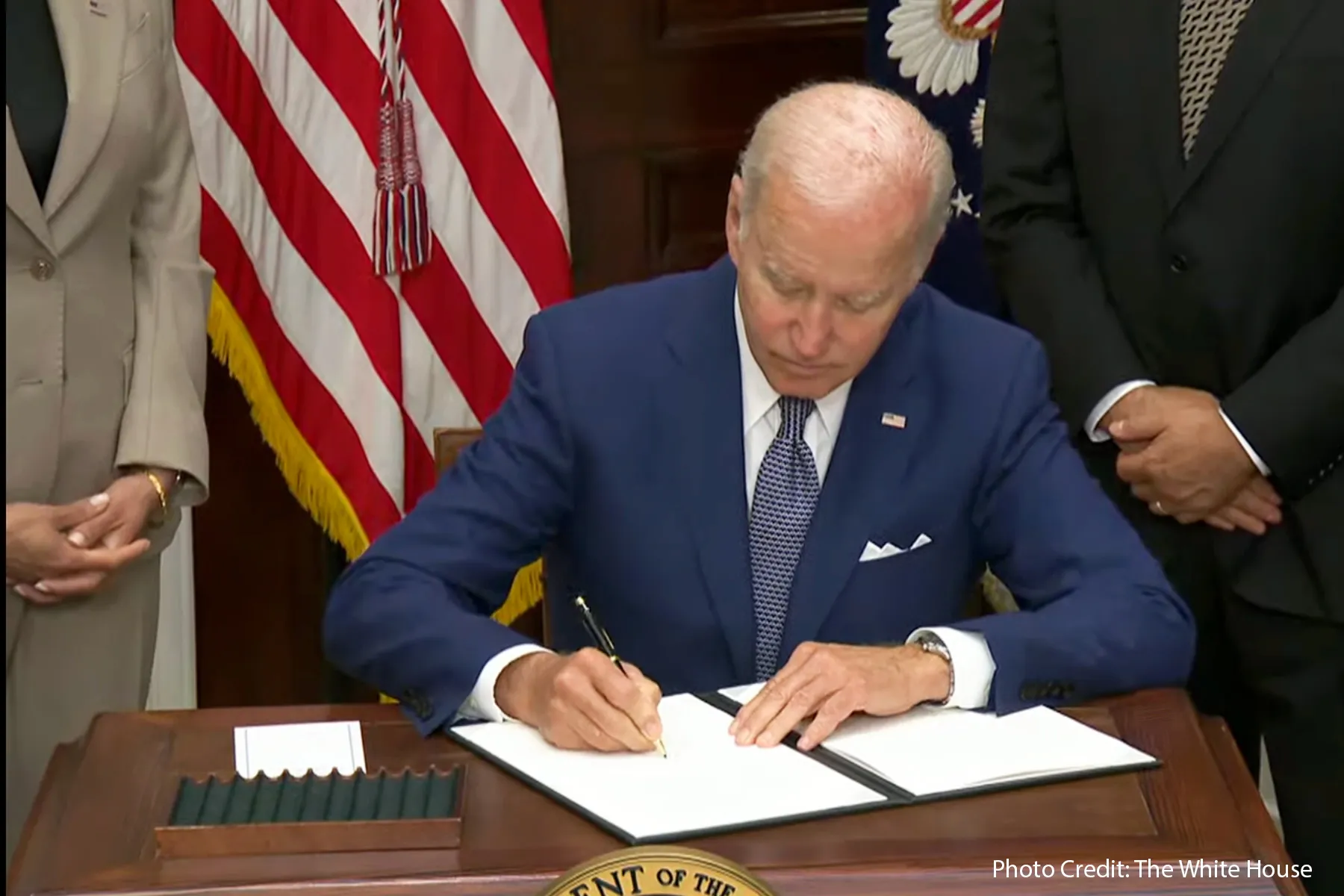 photo of President Biden signing executive order