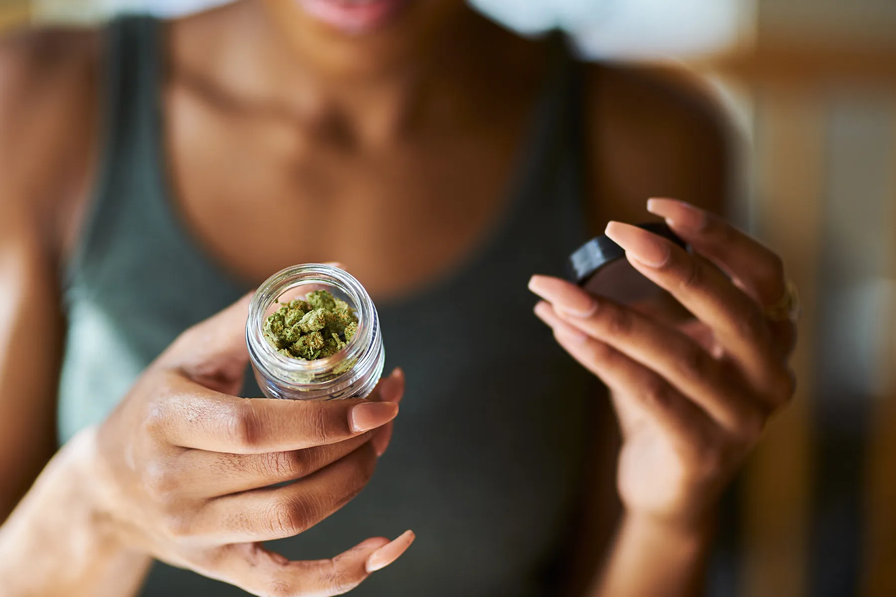 photo of lifestyle marijuana woman jar