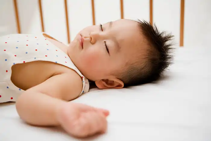 photo of baby sleeping in crib