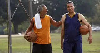 men holding basketballs