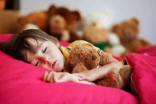 photo of boy sleeping with teddy bear other