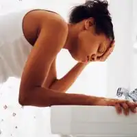 photo of woman rinsing face