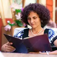 photo of mature woman reading book