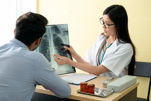 photo of doctors reviewing chest x-ray