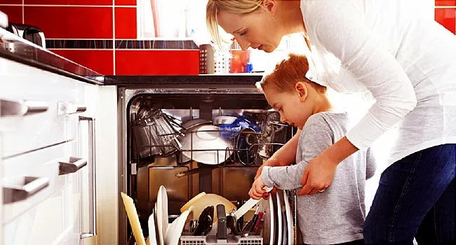 family loads dishwasher