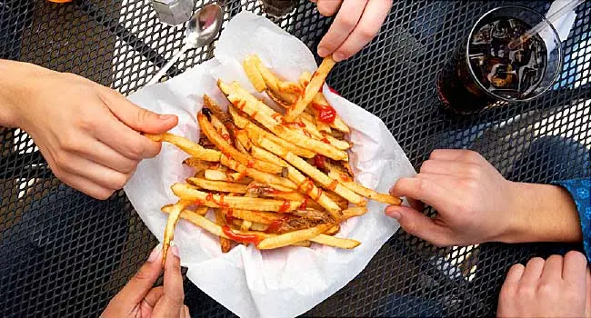 friends sharing french fries