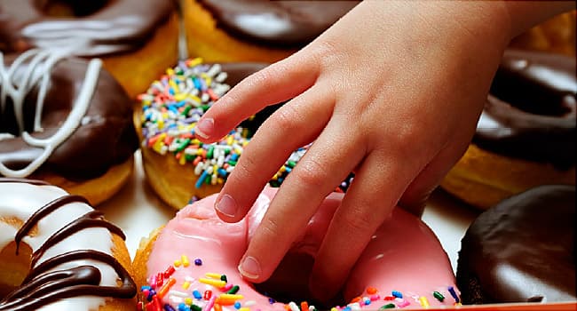 hand reaching for doughnut