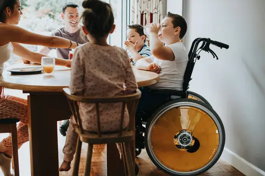 photo of kids parenting family dinner wheelchair