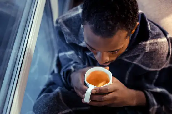 photo of man drinking hot tea