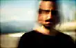 man with blurred face