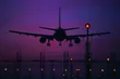 passenger jet landing at night