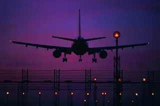passenger jet landing at night
