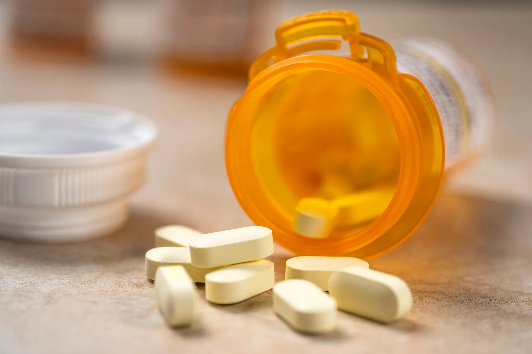 photo of prescription pills spilled from a bottle