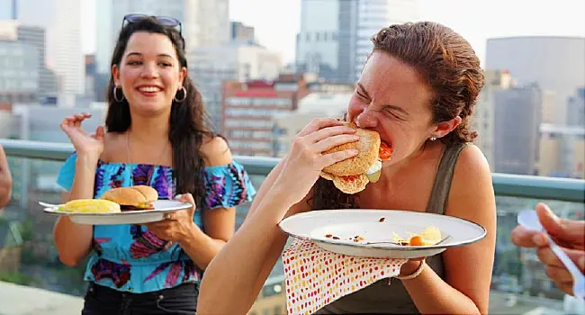 friends enjoying rooftop cookout
