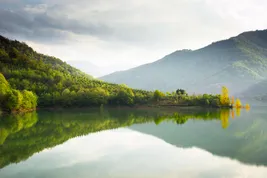 photo of scenic view of quiet lake