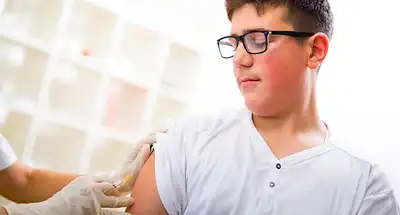 photo of teen getting vaccination