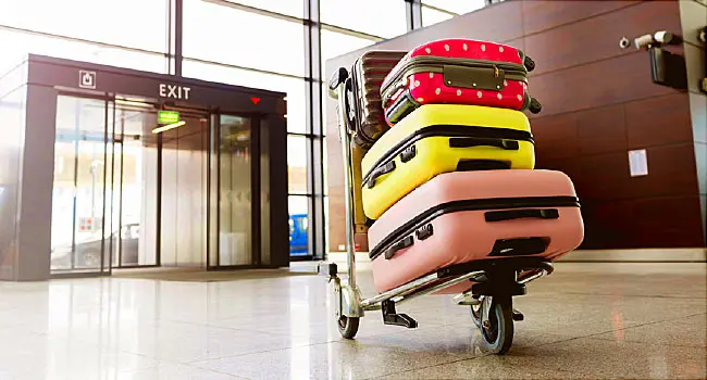 stacked luggage on cart