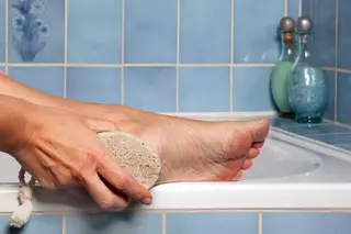 photo of using pumice stone on foot