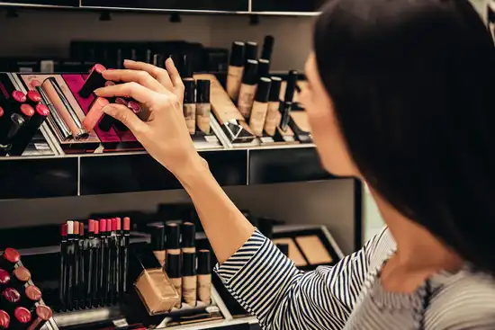 photo of woman buying makeup