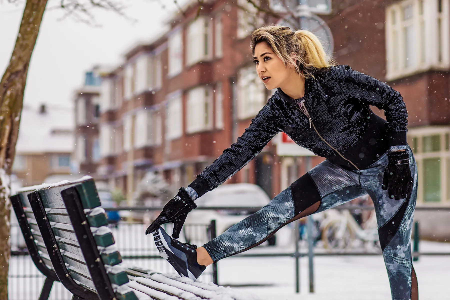 photo of woman stretching in winter cold