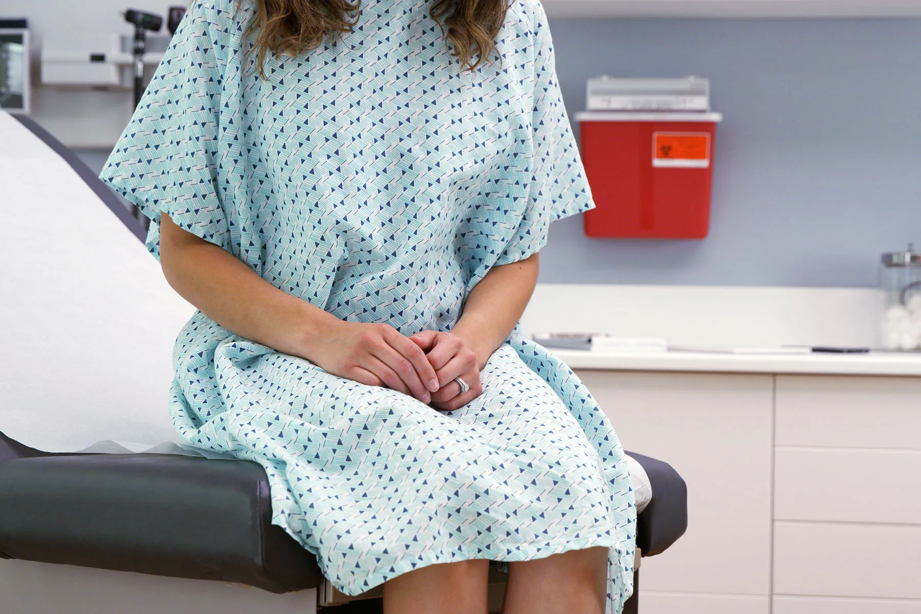 photo of woman waiting in doctor examination room