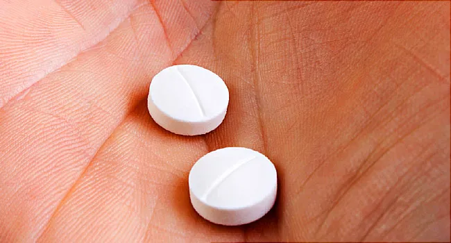 aspirin in hand