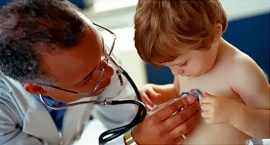 Doctor Using Stethoscope to Examine Toddler