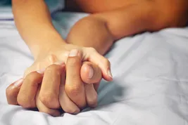 passionate hands on bed