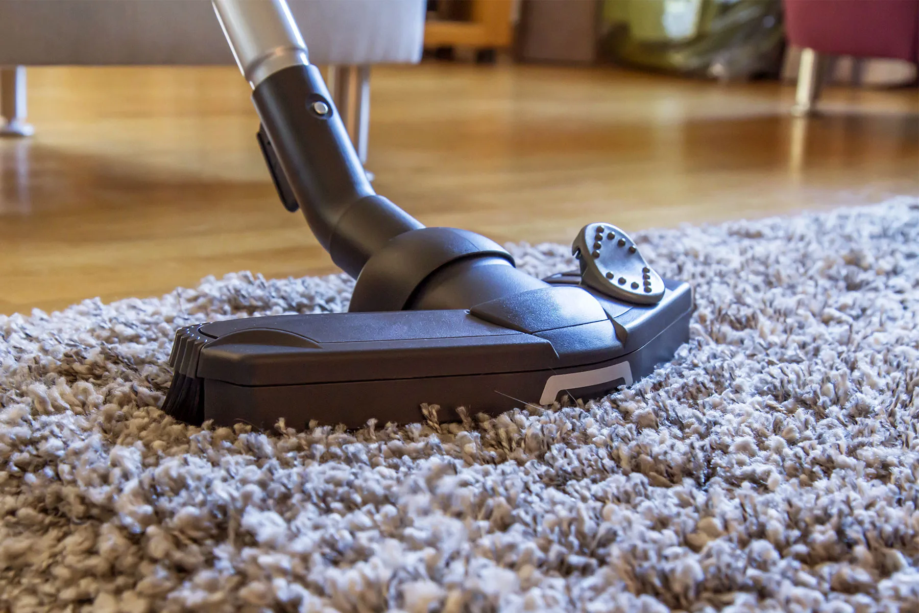 photo of vacuuming rug close up