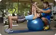 instructor training woman with dumbbells
