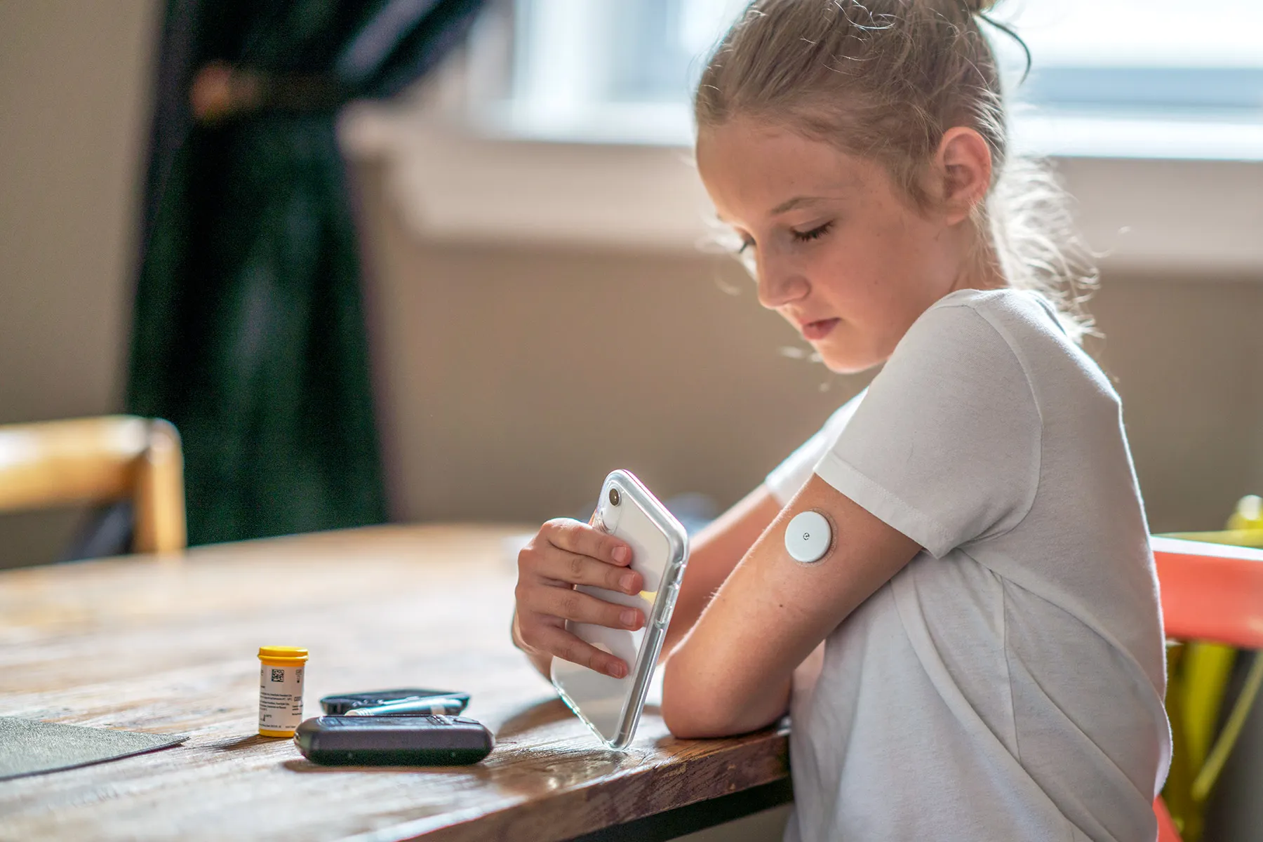 photo of girl checking blood glucose