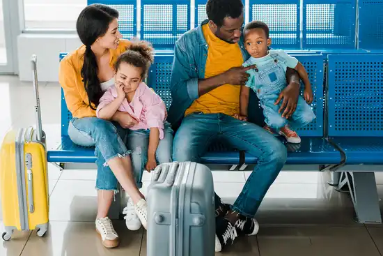 photo of family waiting at gate in airport