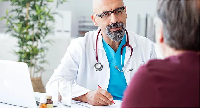 male doctor talking with patient