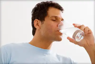 mature man drinking water
