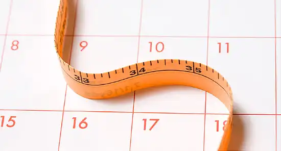 measuring tape and calendar
