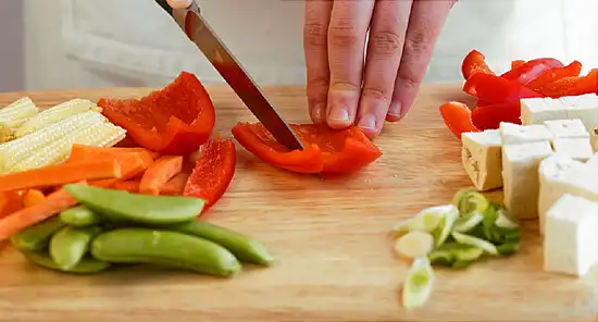 chopping vegetables and tofu