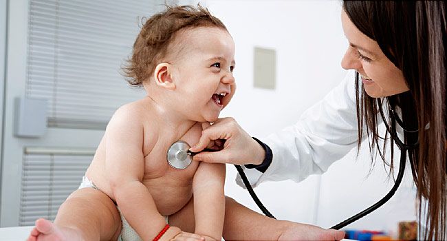 pediatrician listening to baby's heartbeat