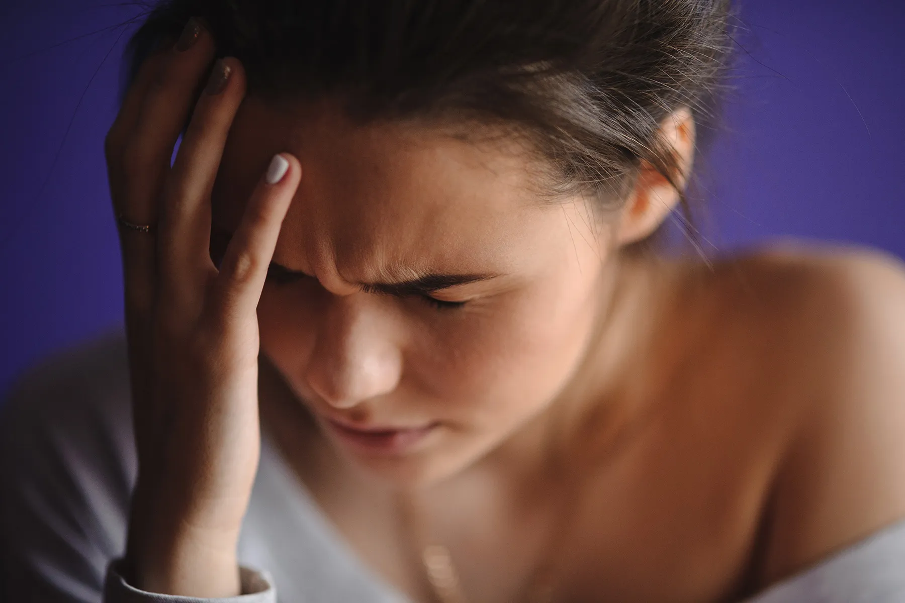 photo of woman with migraine